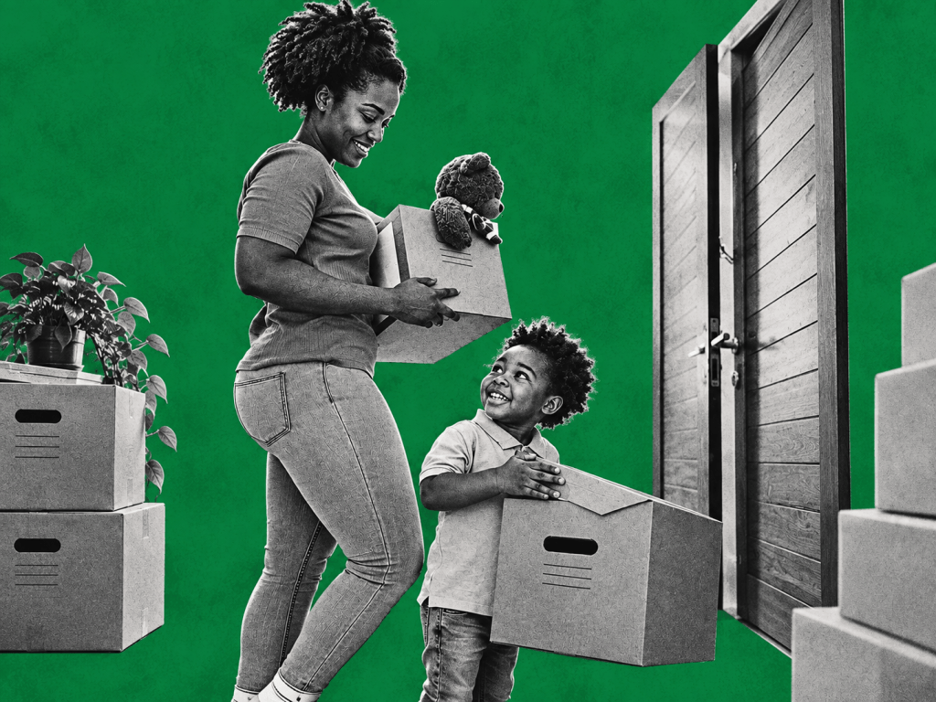 A mother and child carry moving boxes into their new home, capturing the optimism of a fresh start and the importance of creating housing that families can genuinely afford, access and build a future in.