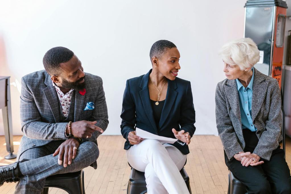 Hold or Let Go? Navigating the Jamaican Property Market in a Changing Era people talking while sitting