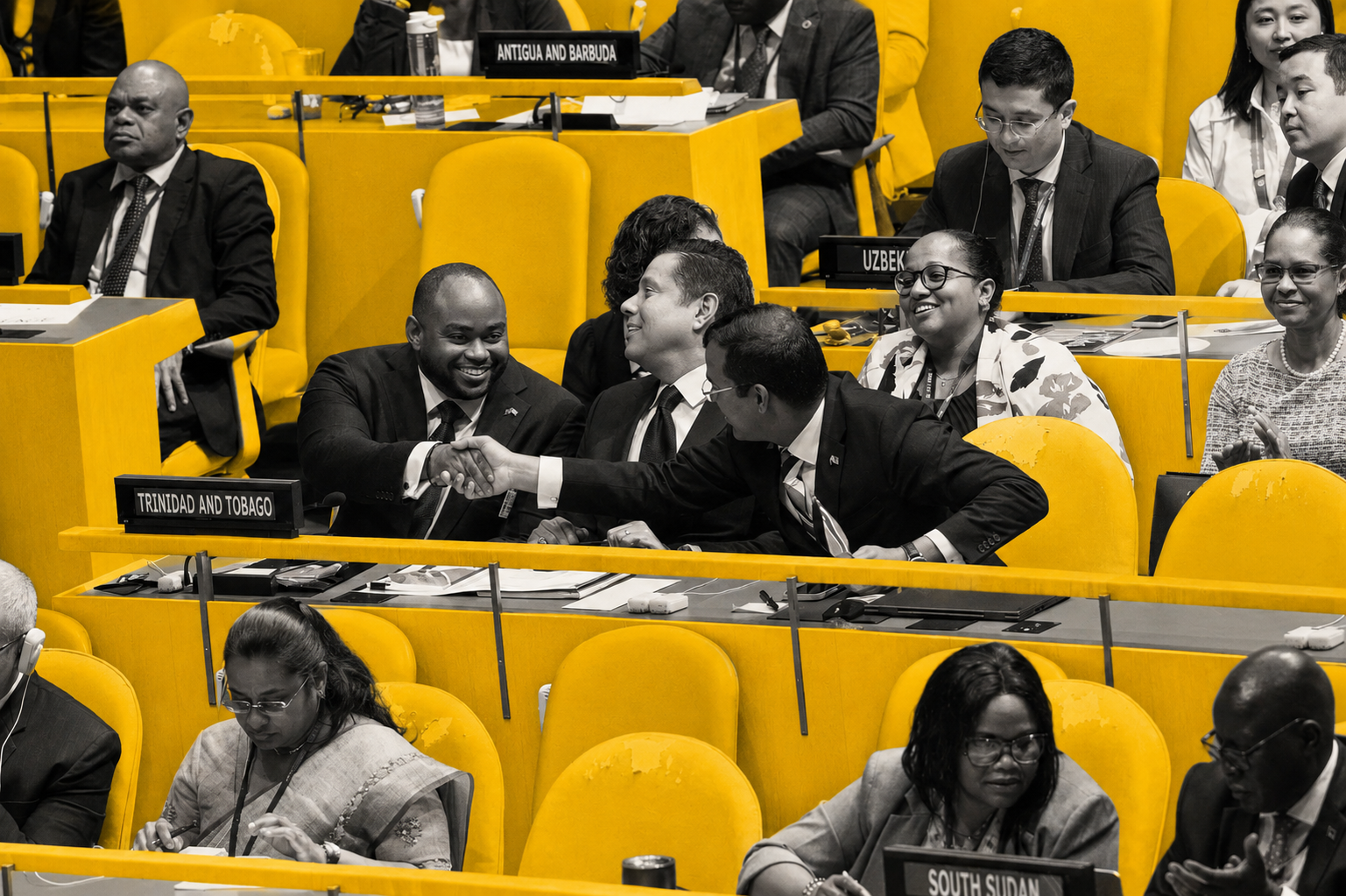 Caption: (from left) Minister of Foreign and CARICOM Affairs, The Honourable Sean Sobers, shakes hands with Permanent Secretary in the Minister of Foreign and CARICOM Affairs, Randall Karim, at the conclusion of the UN General Assembly vote to elect new non-permanent members to the UN Security Council for 2027-2028. Photo: © UN Photo