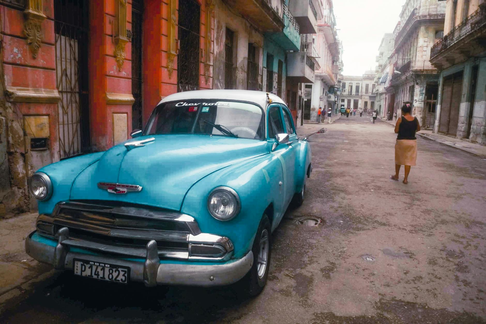Photo by Mehmet Turgut Kirkgoz of a parked vintage car at a curb