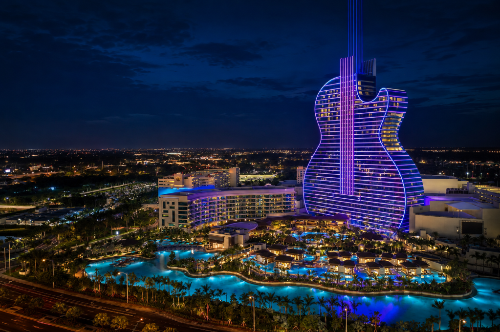 The guitar-shaped Seminole Hard Rock Hotel & Casino in Hollywood, Florida, illuminated at night. The image is illustrative and does not depict the proposed Hard Rock development in Montego Bay. Photo illustration.