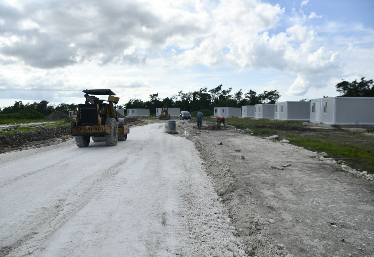 Road construction and rows of modular container homes at Shrewsbury, Westmoreland, Jamaica