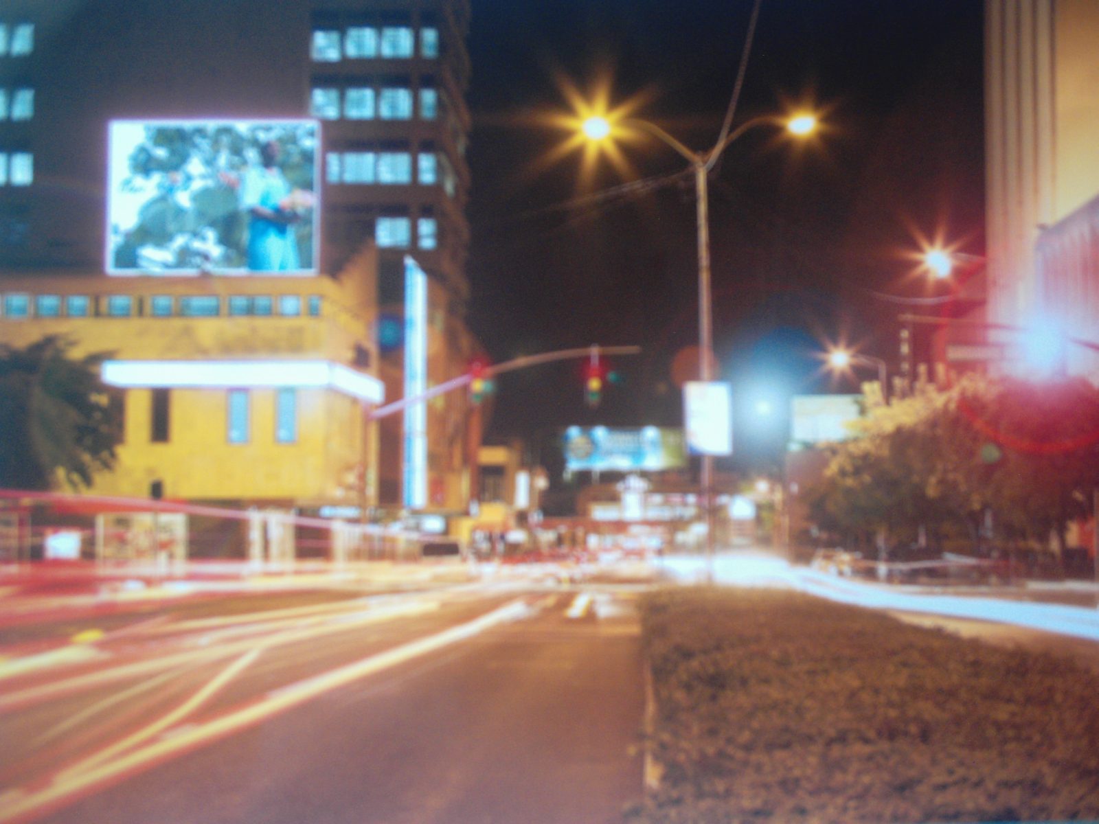 Office and apartment buildings in New Kingston lit up at night