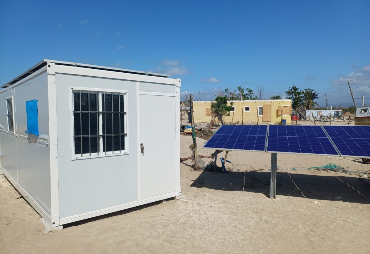 Coastal community of Parottee, St Elizabeth, with a solar powered community energy centre and storm damaged houses