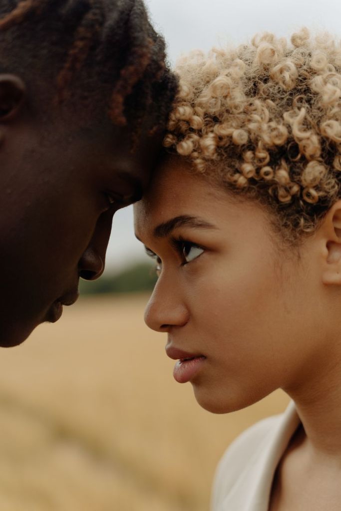 woman and man looking at each other - Photo by cottonbro studio