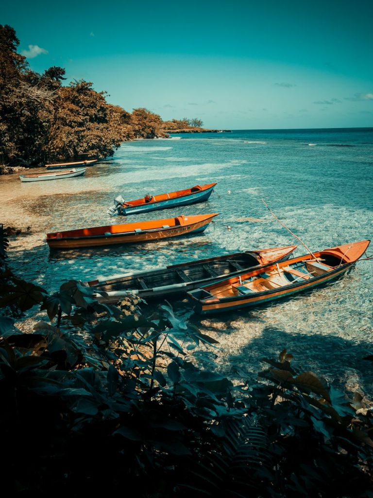 Jamaica Reaffirms Public Beach Access in Montego Bay and Ocho Rios wooden boats on the beach