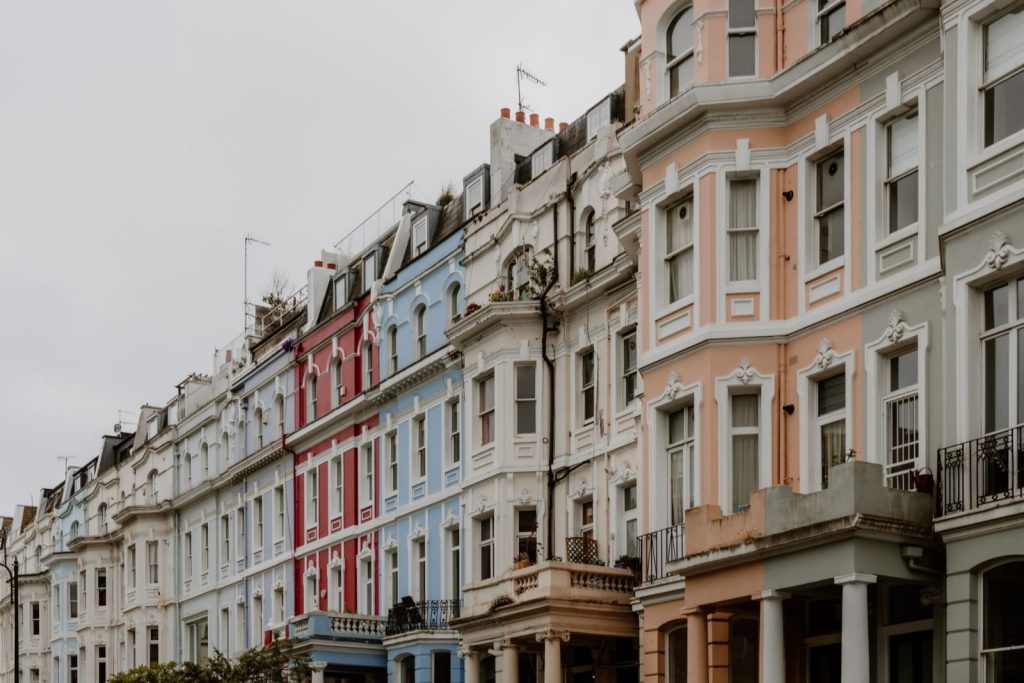 The Cost of Control: Britain’s Housing Experiment and What Jamaica Should Learn colorful tenements in old town - Photo by Josh Withers