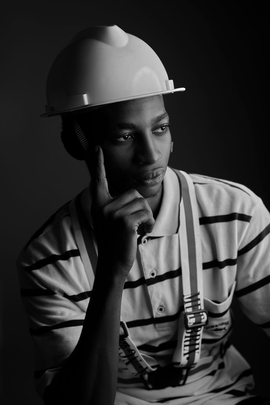 contemplative engineer in black and white portrait