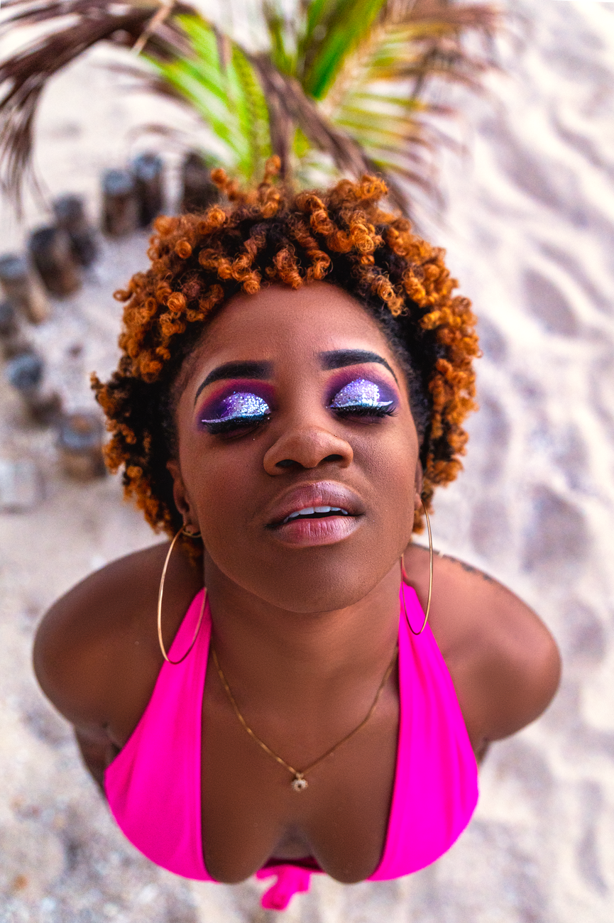 overhead shot of a woman wearing a pink bikini