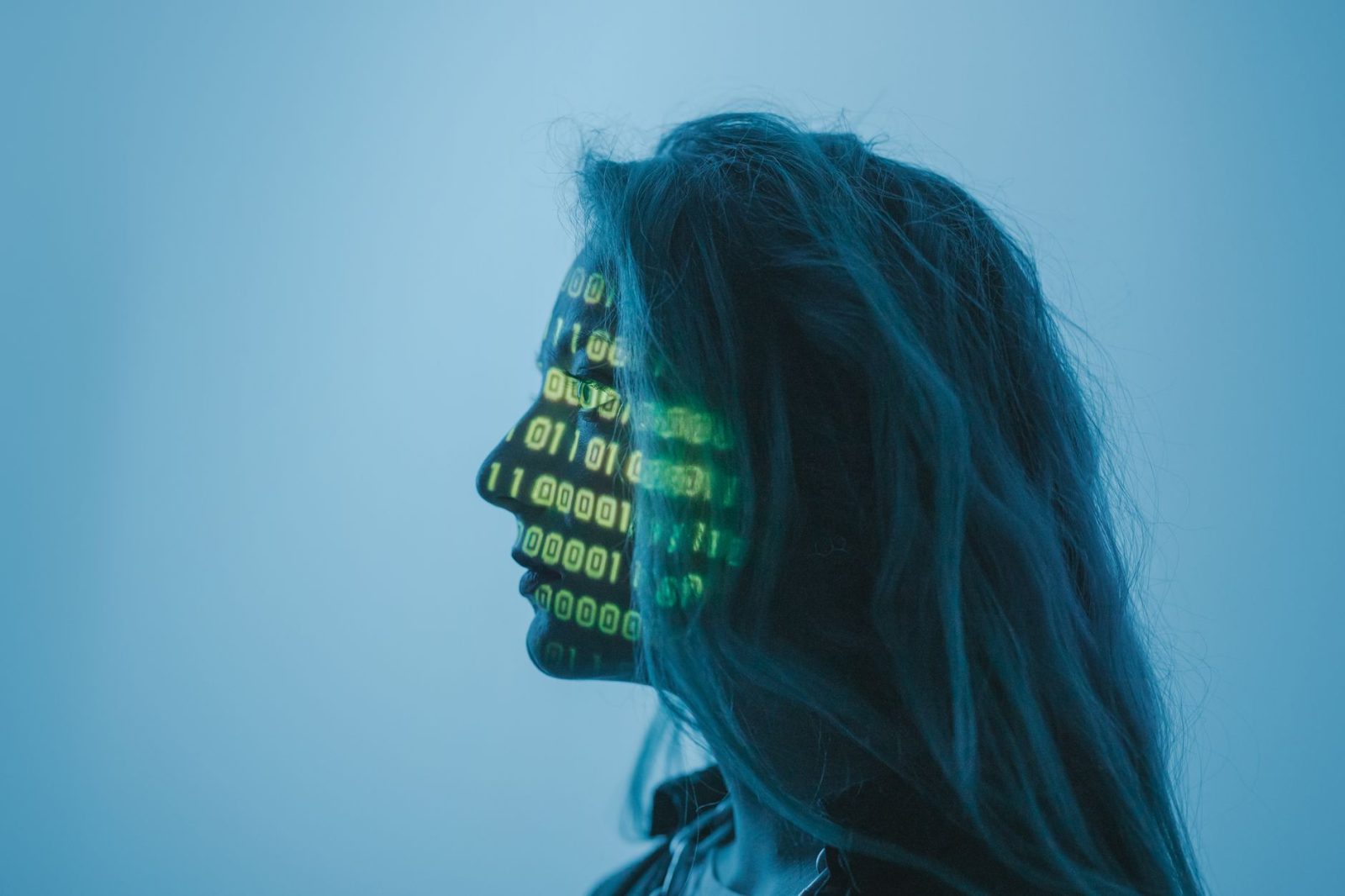 a woman with number code on her face while looking afar - Photo by cottonbro studio