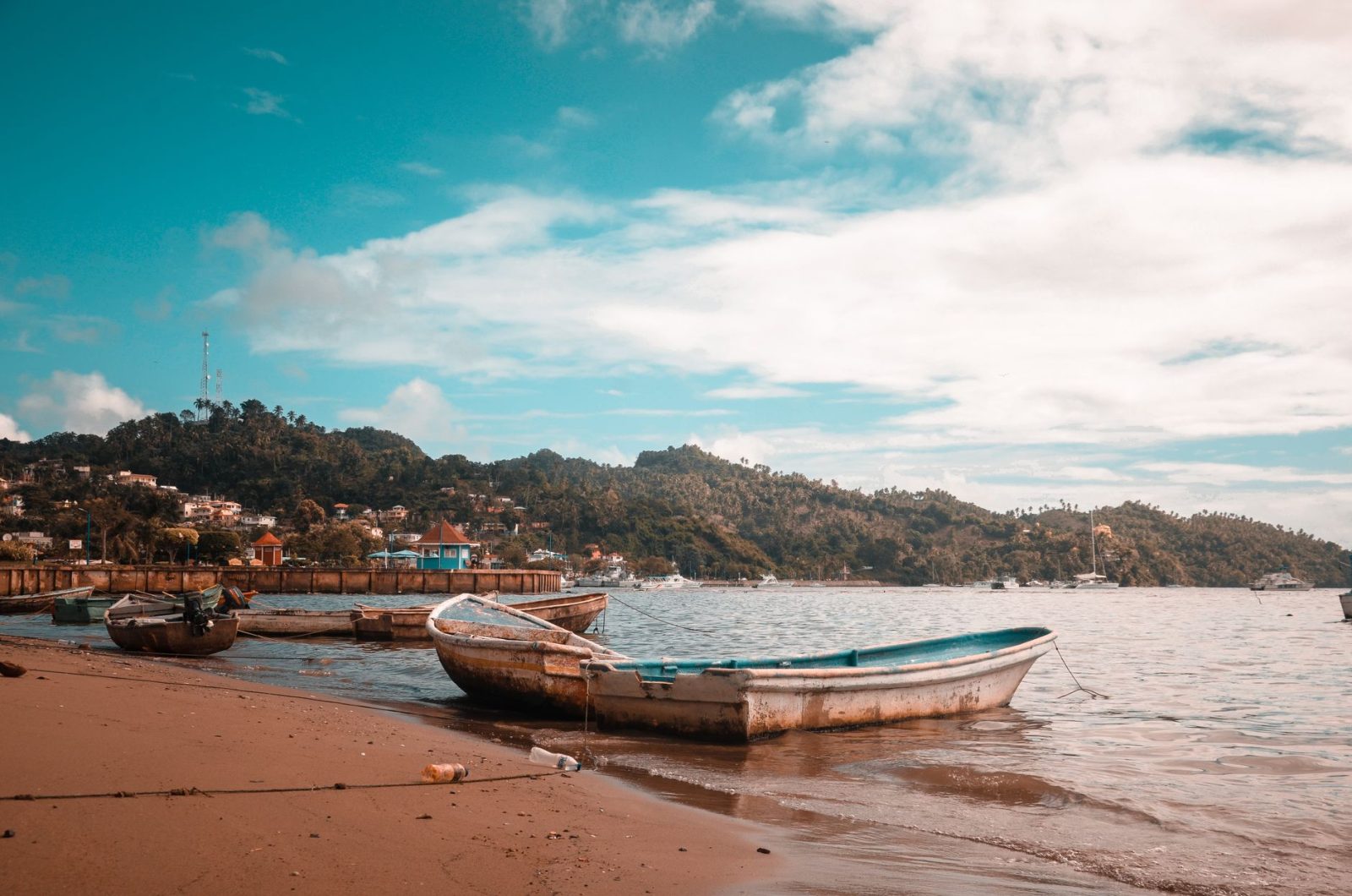 boats on seashore during daytime