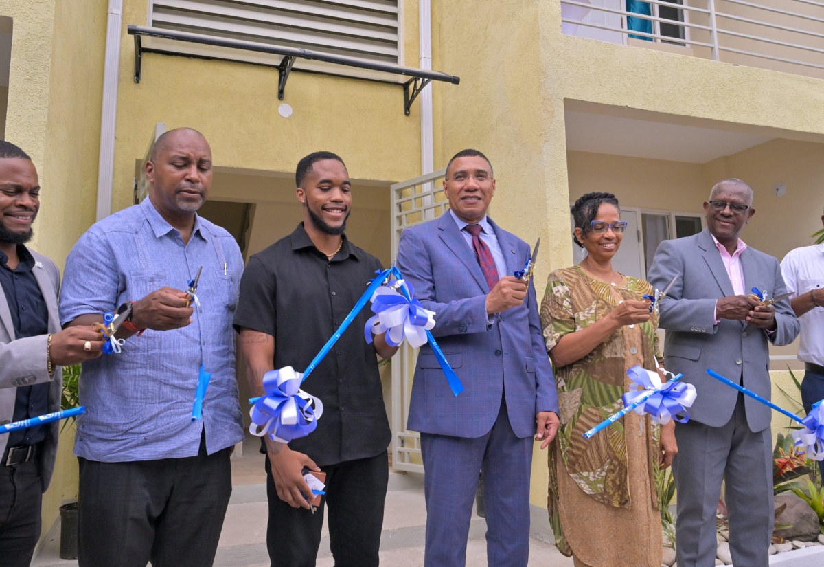 Key handover at the National Housing Trust's Vineyard Town Housing Development in Kingston