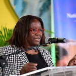 Housing official speaking at Jamaica's World Habitat Day Exposition 2026 on climate resilient homes