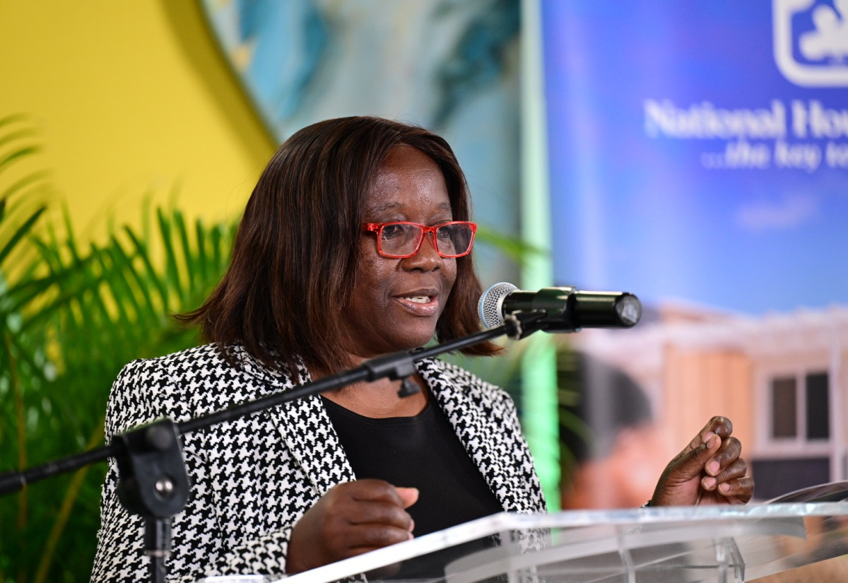 Housing official speaking at Jamaica's World Habitat Day Exposition 2026 on climate resilient homes